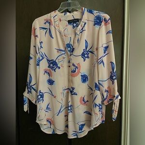 Ivanka Trump pink floral blouse, elbow length.